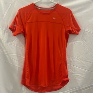 Orange Nike women’s athletic shirt